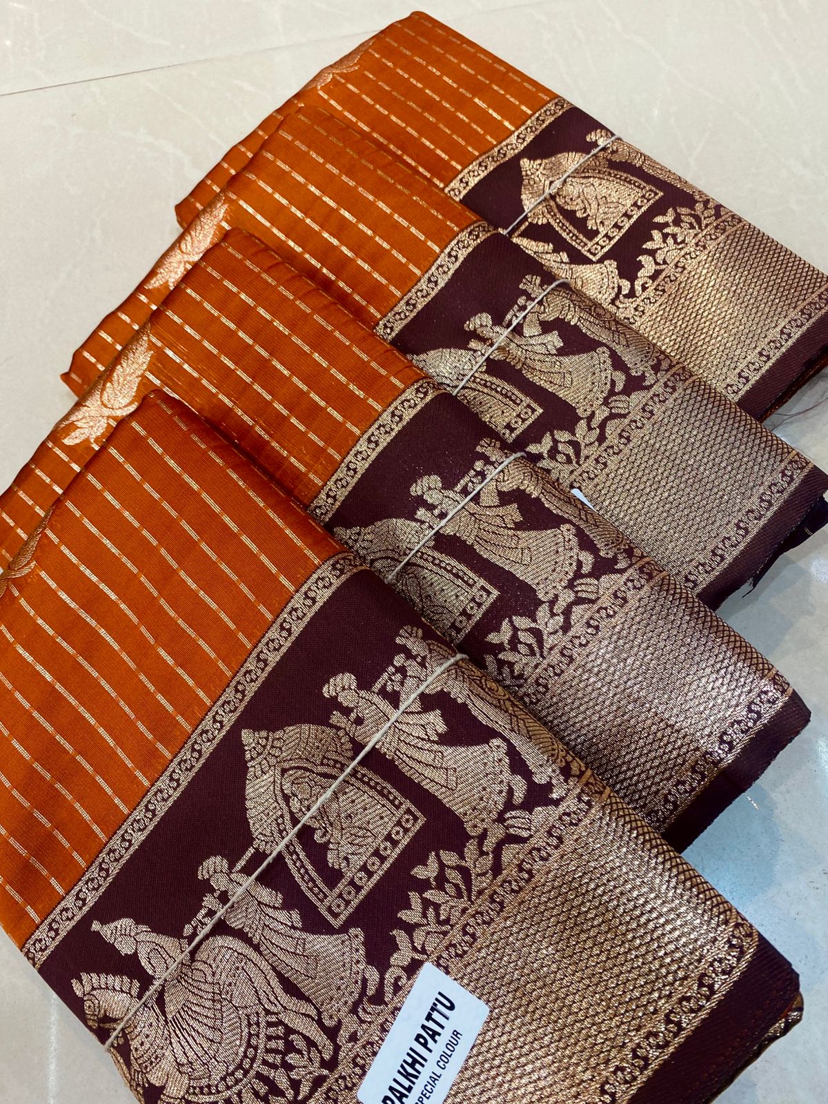 Rust orange with brown border Pallaki design
